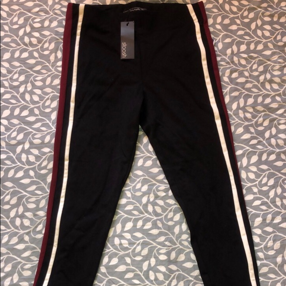 Black pants with a purple and white stripe